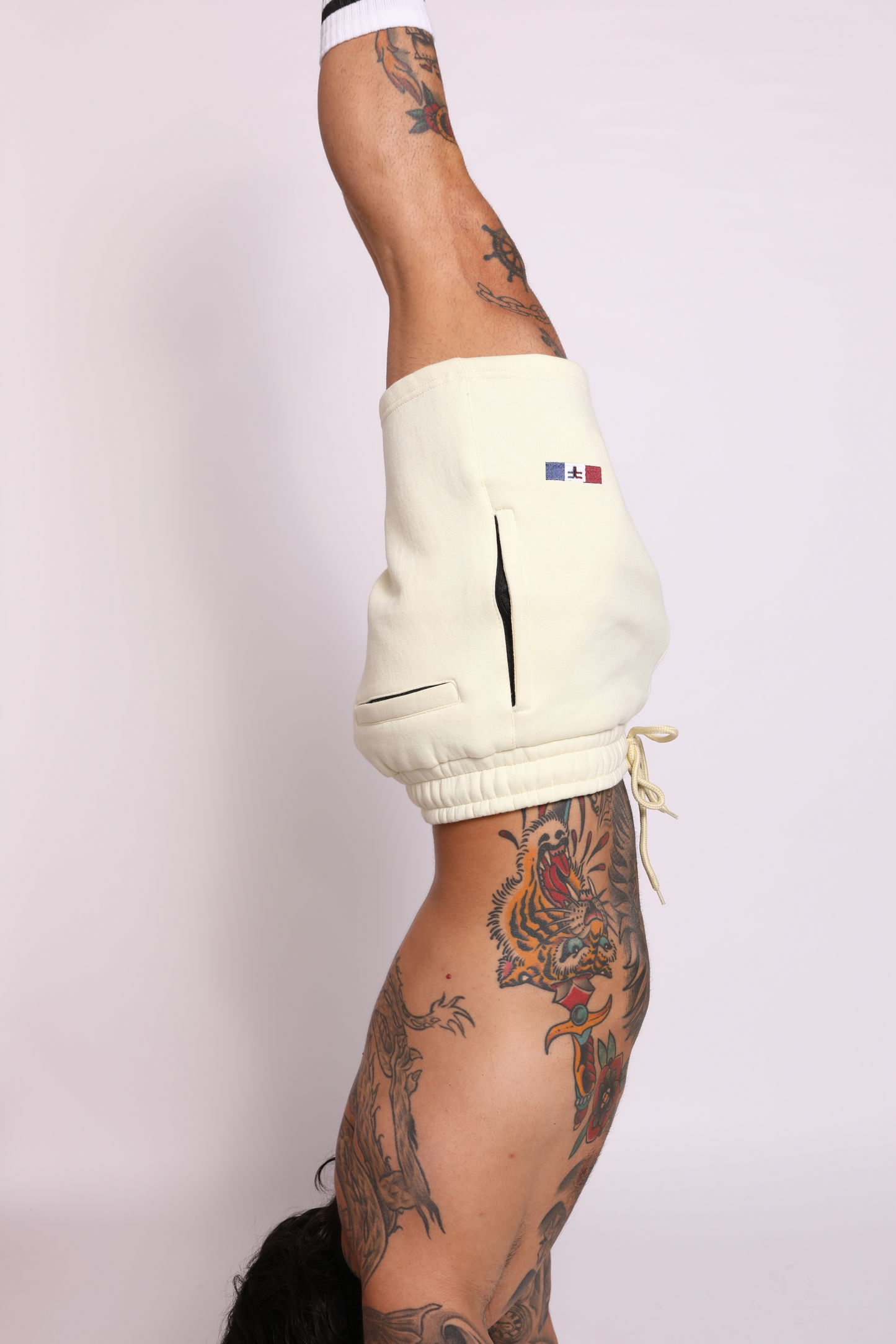 tapered fit zipper short - pastel light yellow