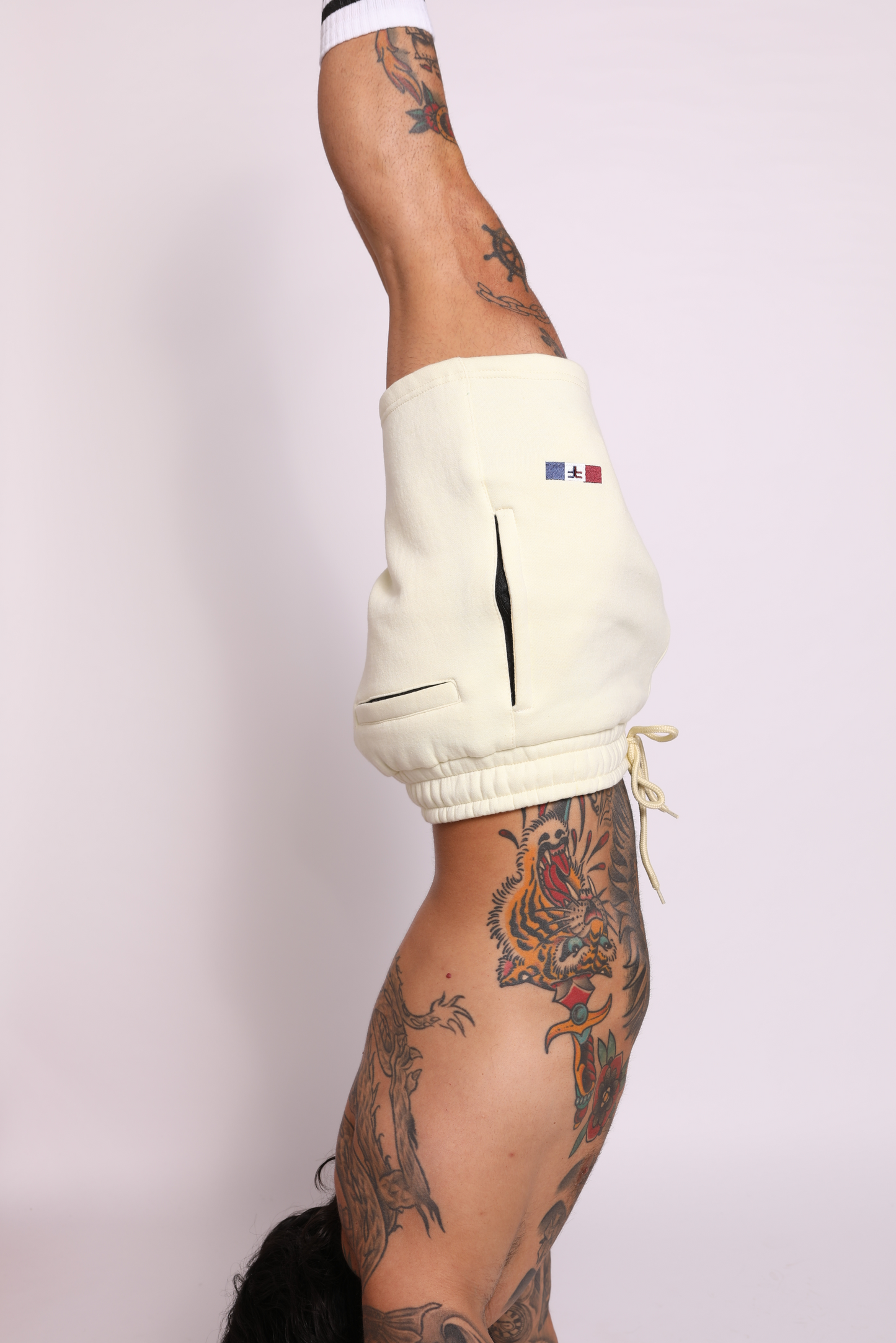 tapered fit zipper short -  pastel light yellow